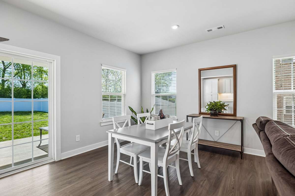 The dining area will accommodate a larger table, side table, buffet, and more.