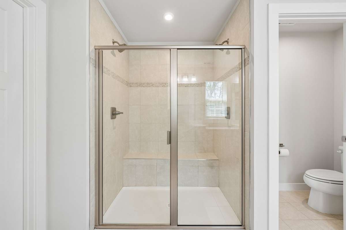 The walk-in shower has a nice, long built-in bench.