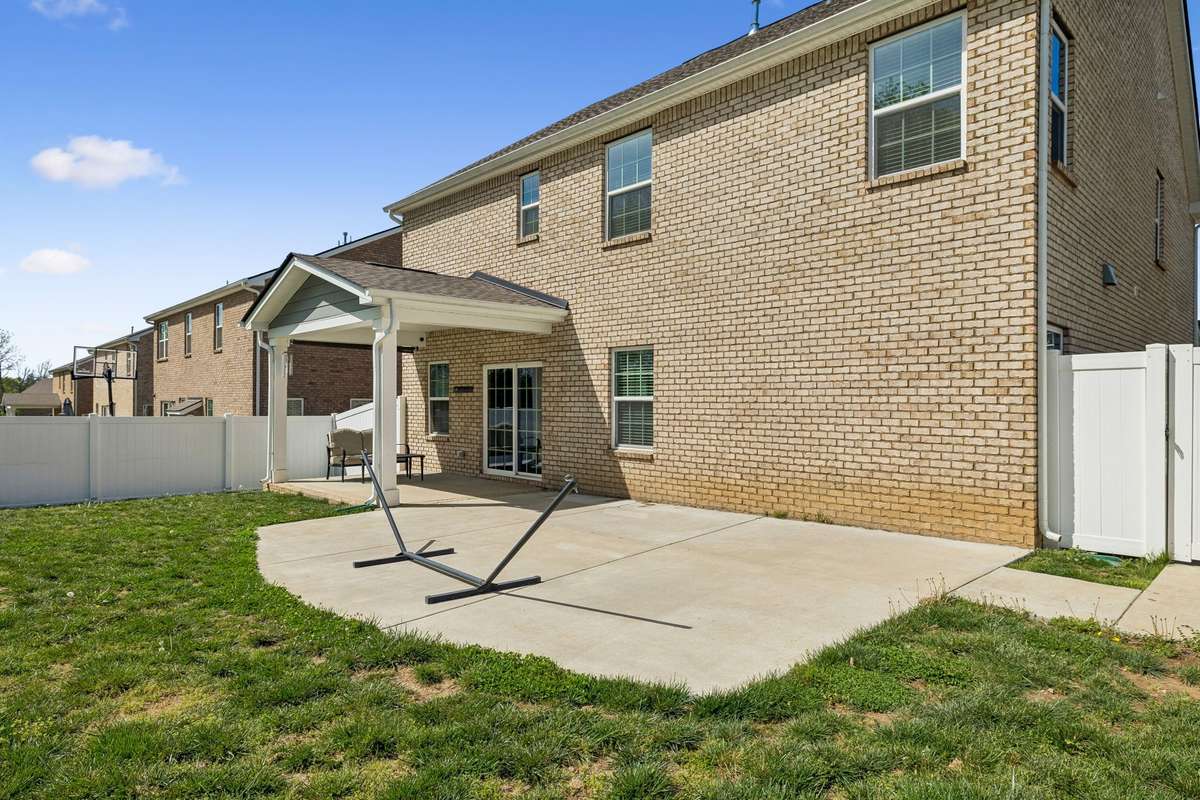 The open patio area is perfect for a grill, smoker, fire pit, and more.