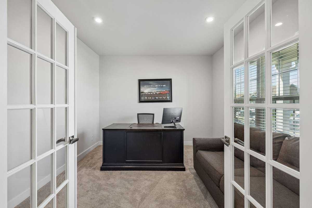 The office is located in the front part of the home, overlooking the porch. This gives nice lighting while eliminating direct sun. Would also make a good guest room, playroom, library, and more.