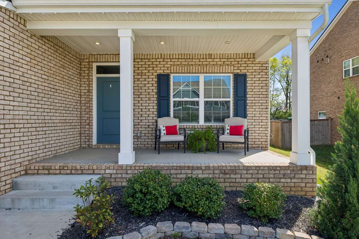 Inviting front porch with ample area for chairs, plants, and more.