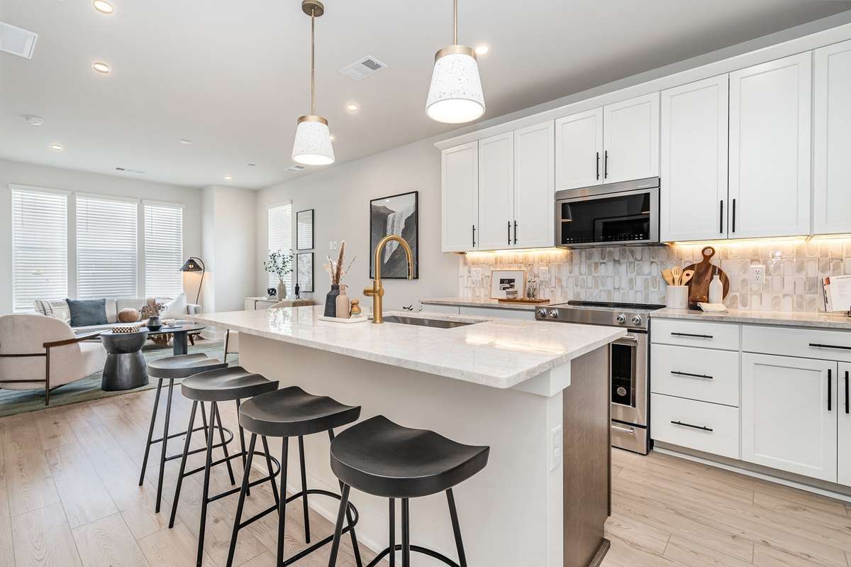 Eat in island is ideal for additional seating. *Photos are of a similar floorplan with differing finishes.*