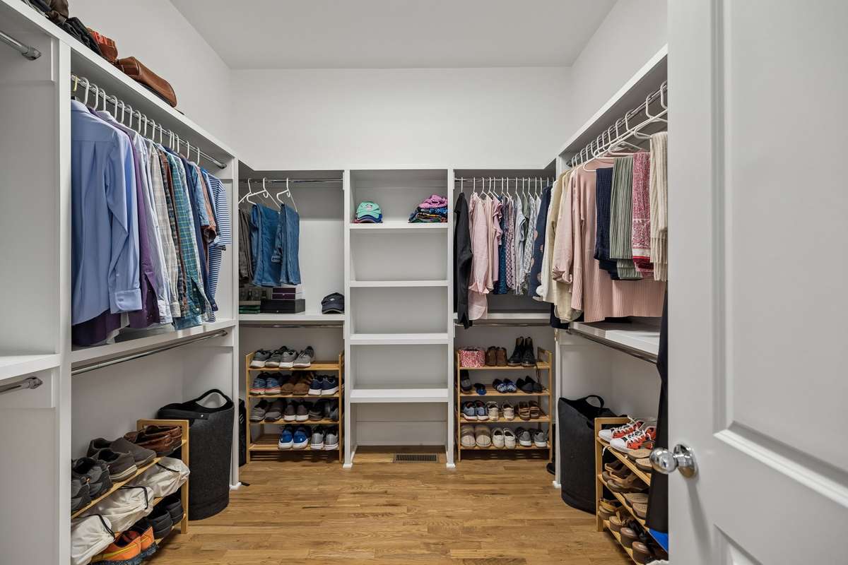 A thoughtfully designed, expansive walk-in closet within the primary suite