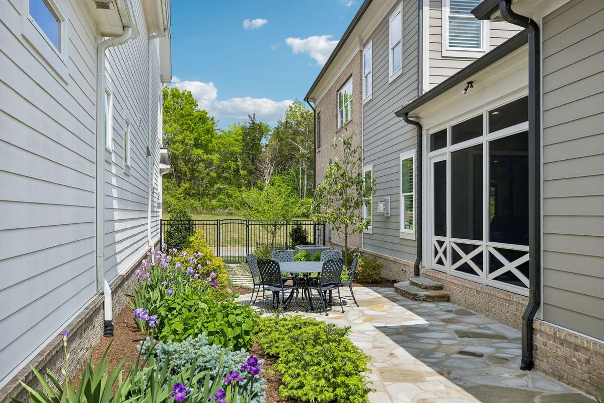 Serene courtyard framed by lush greenery