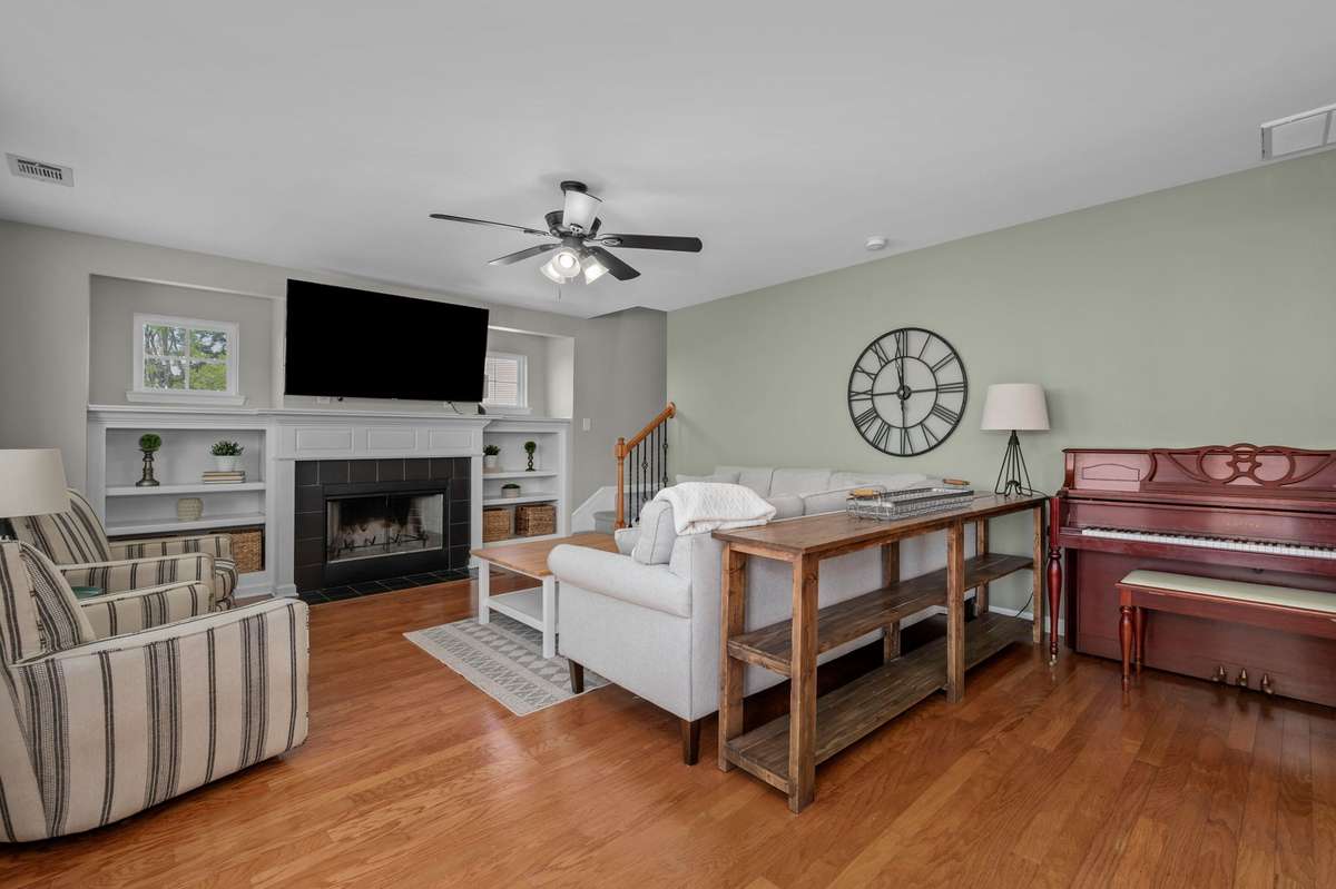 We love this cozy living built-ins and a fireplace.