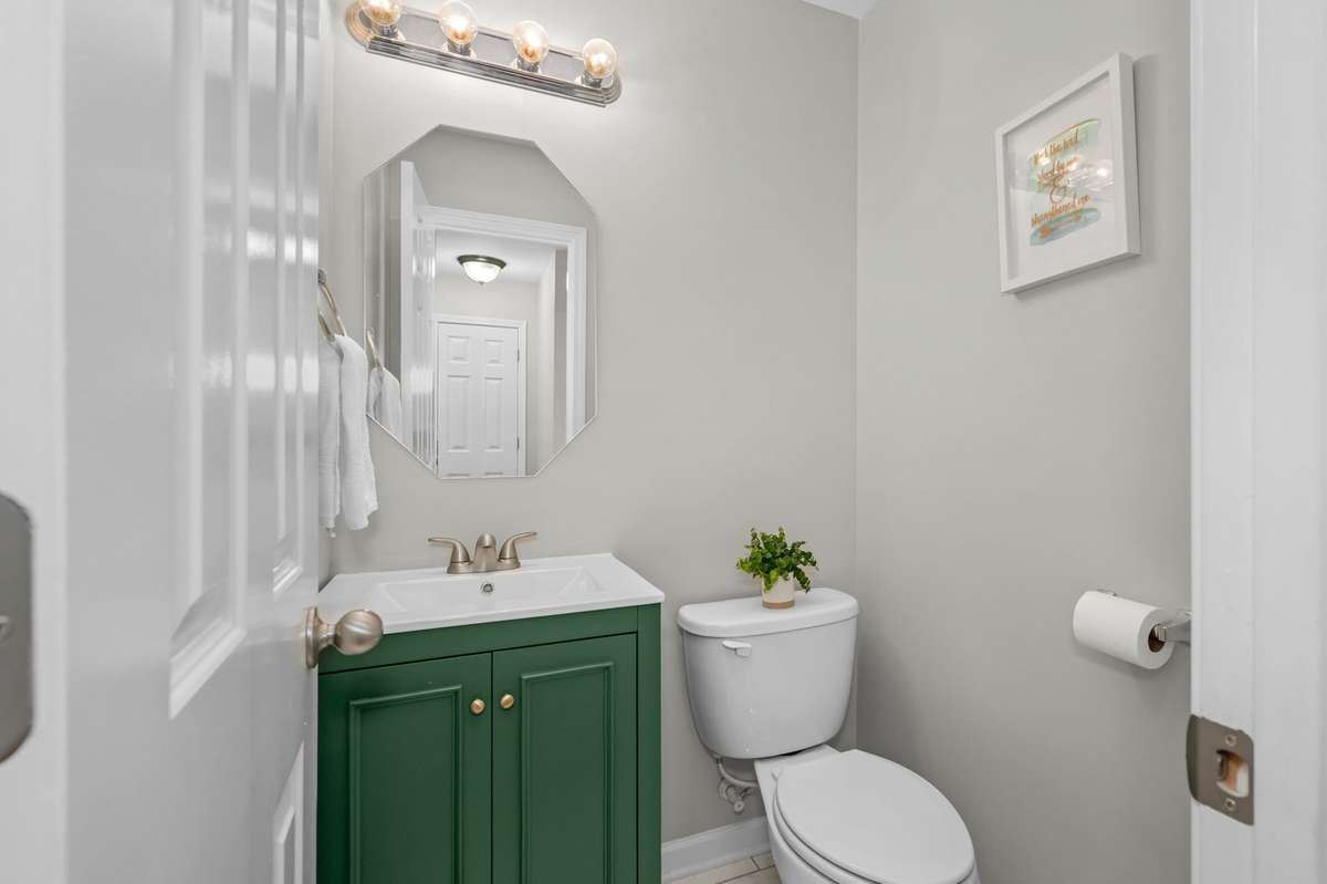 First floor half bath with a fun pop of color!