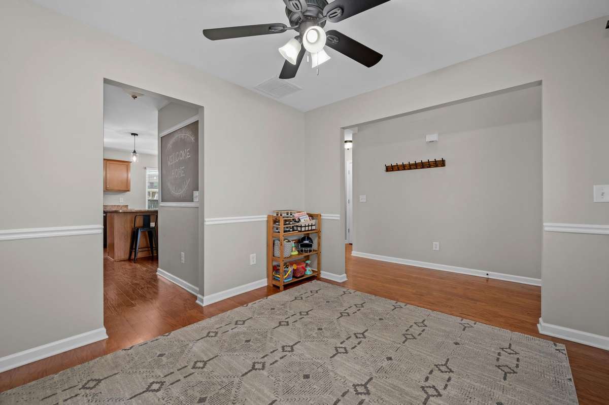 Front flex room looking toward kitchen and entry.
