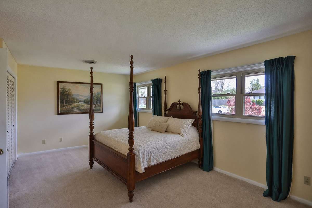 Upstairs bedroom. Virtually staged.