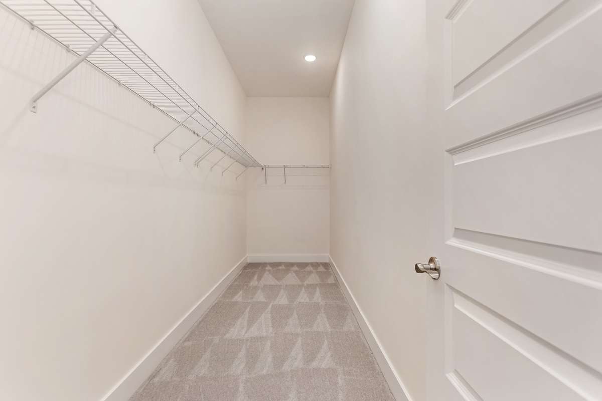 Large walk-in closet in primary bedroom.