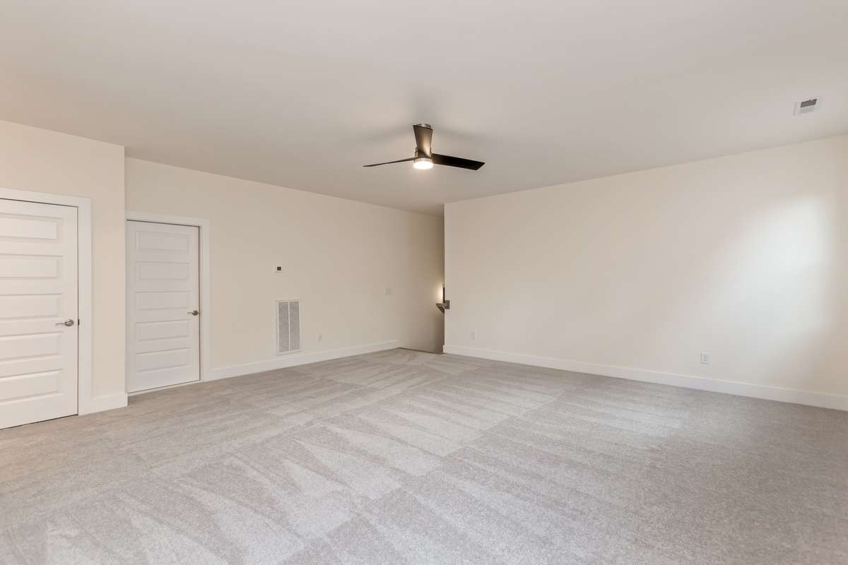 Second floor bonus room has access to a spacious storage area.
