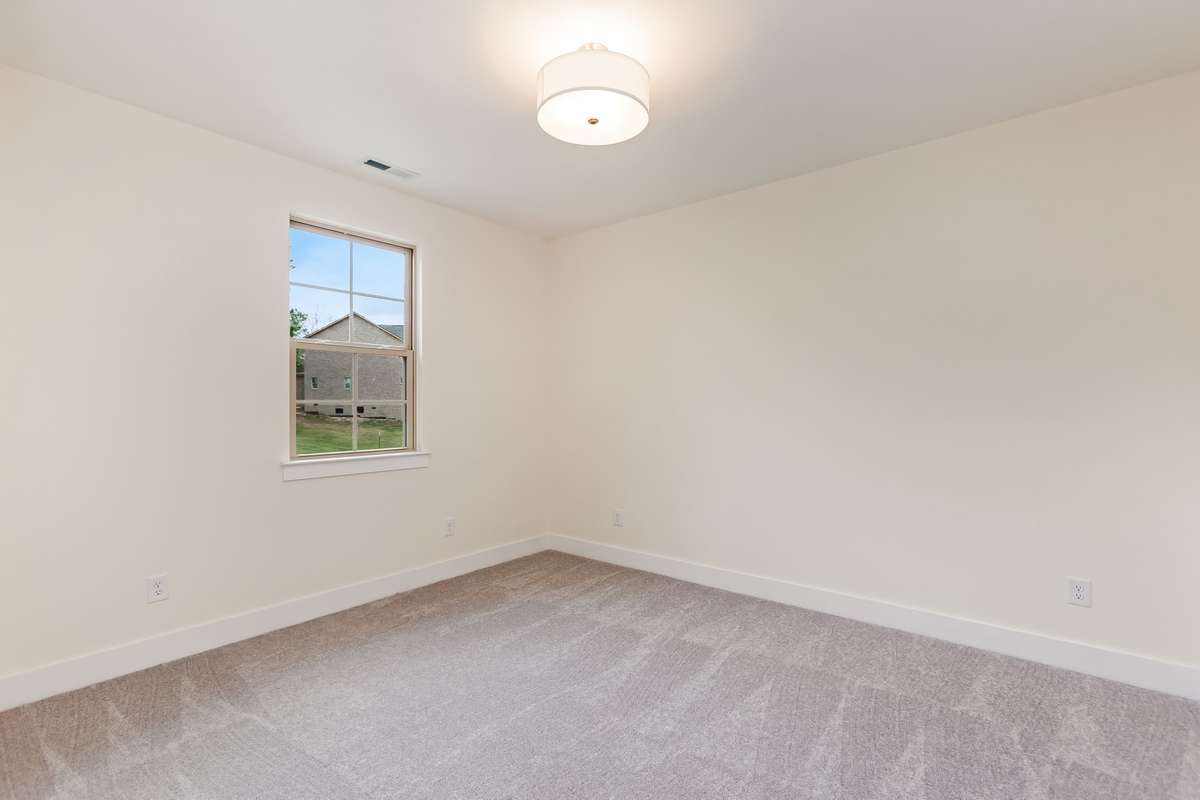 One of two bedrooms located on the second floor.