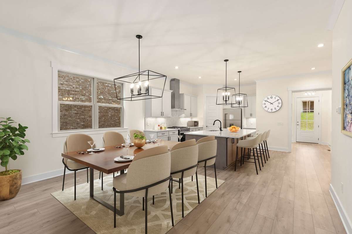 Open concept kitchen, living and dining. Photos of previous built home.