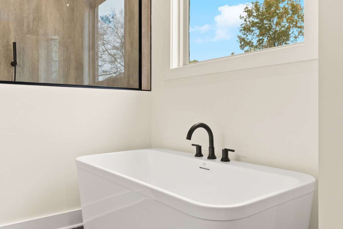 Freestanding tub in primary bathroom.