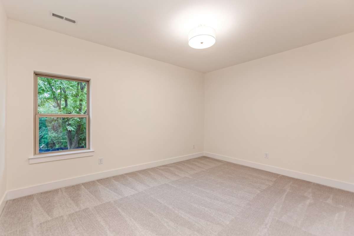 Large bedroom on the basement level with a very large walk-in closet.