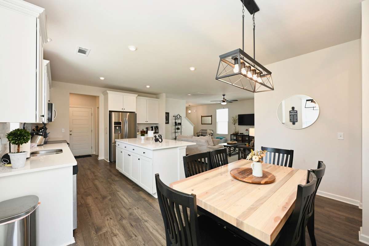 Dining area off of kitchen opens to covered back porch.