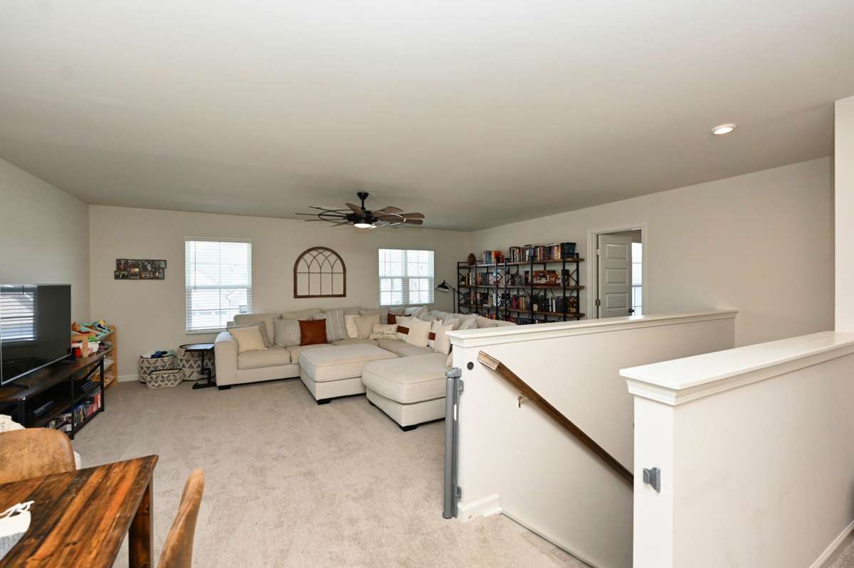 Upstairs rec room has area for game table and lots of room for playing or just lounging around watching tv