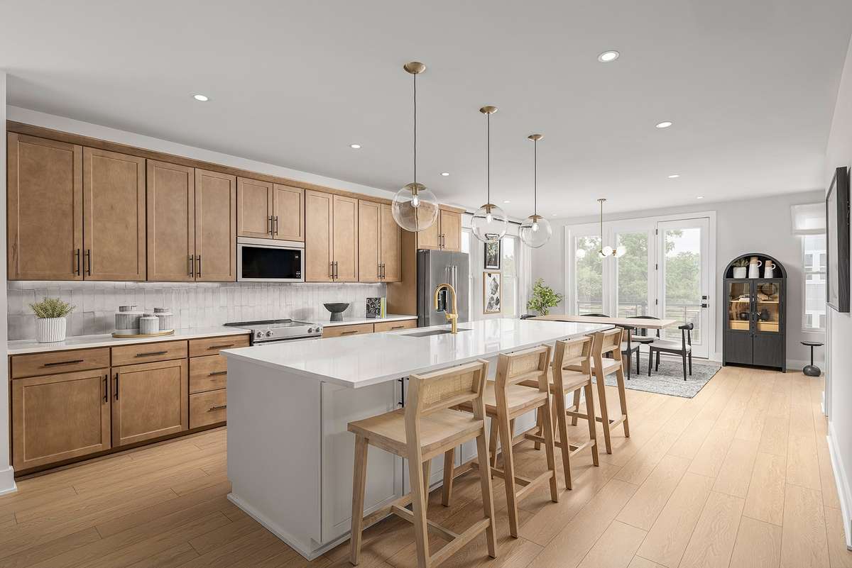 The kitchen features ample cabinetry, modern appliances, and generous counter space, making it ideal for everyday cooking or entertaining. *Photos are of a similar floorplan with differing finishes*