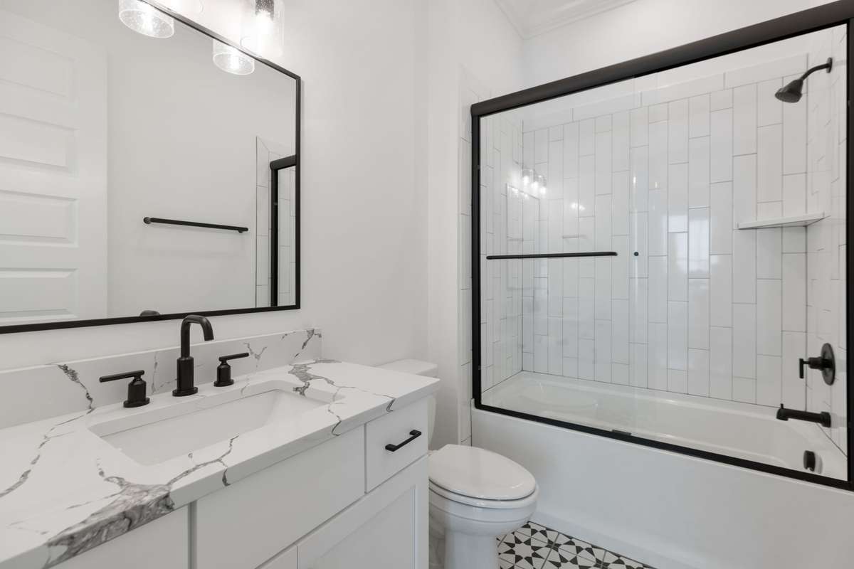 Guest bathroom on main floor with new countertops and added glass shower door