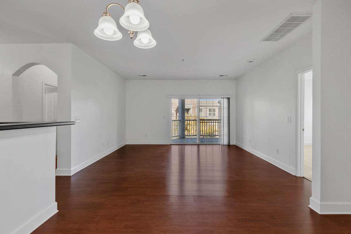 Beautiful flooring in living areas... also notice the arched doorway adds charm
