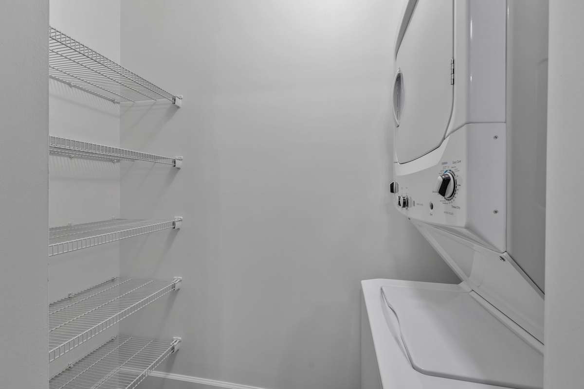 Extra shelving added for storage needs in utility room