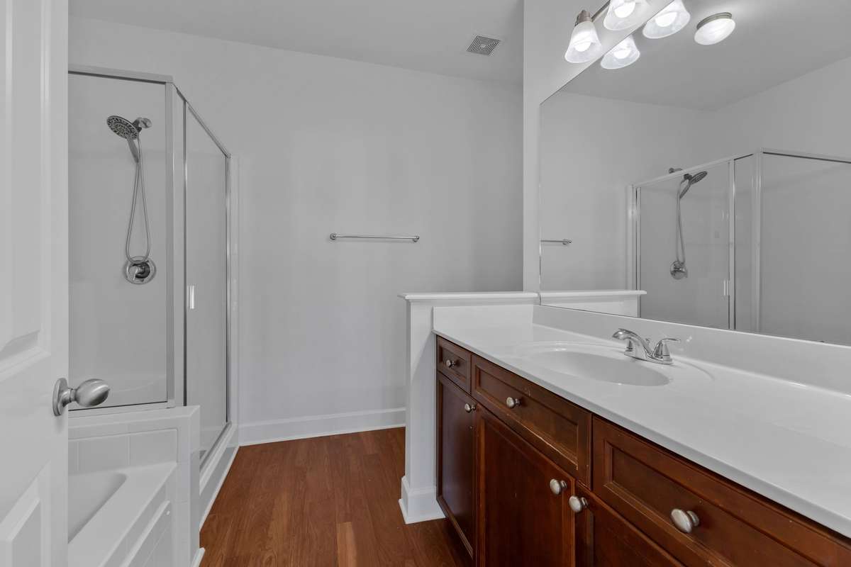 Primary ensuite bath includes separate shower and oversized tub