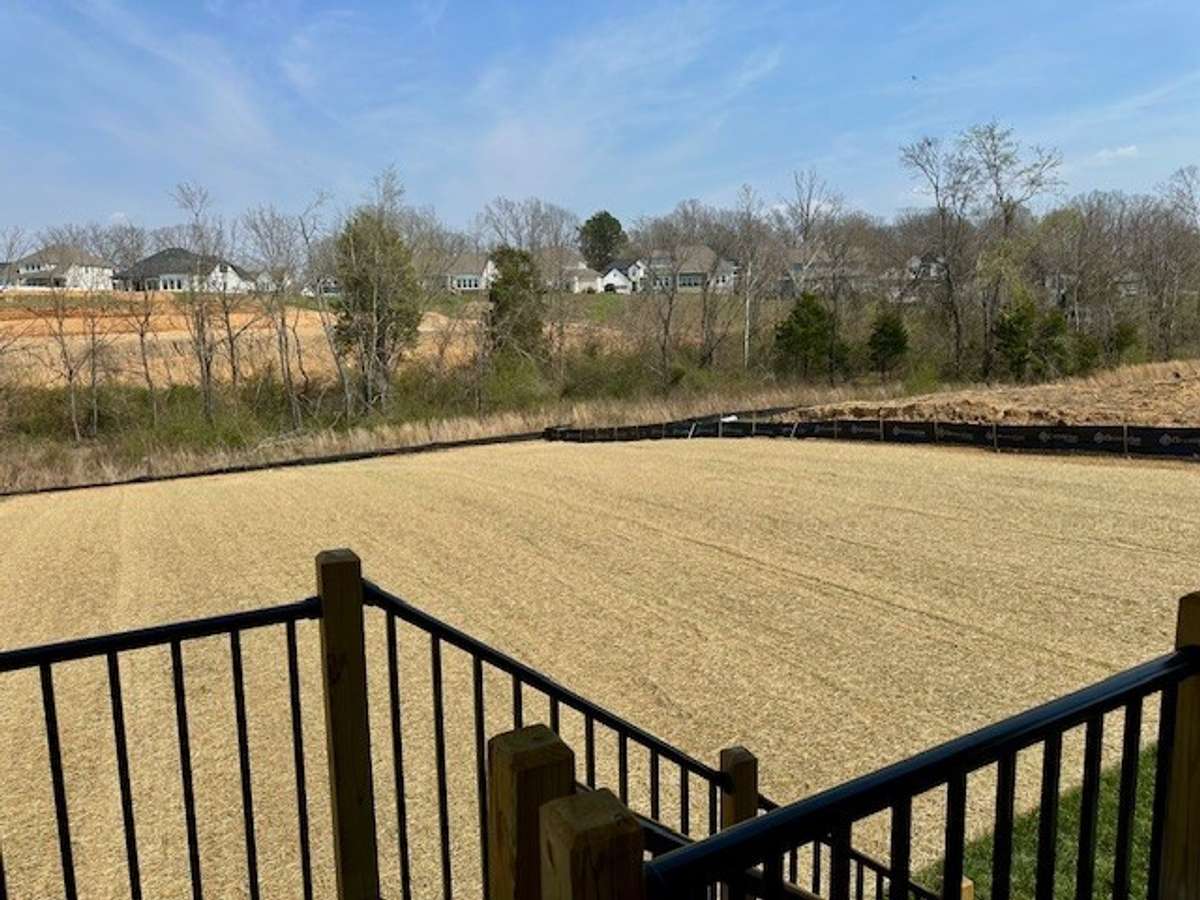 Seed and straw has just gone down in this large backyard, the perfect season to grow!