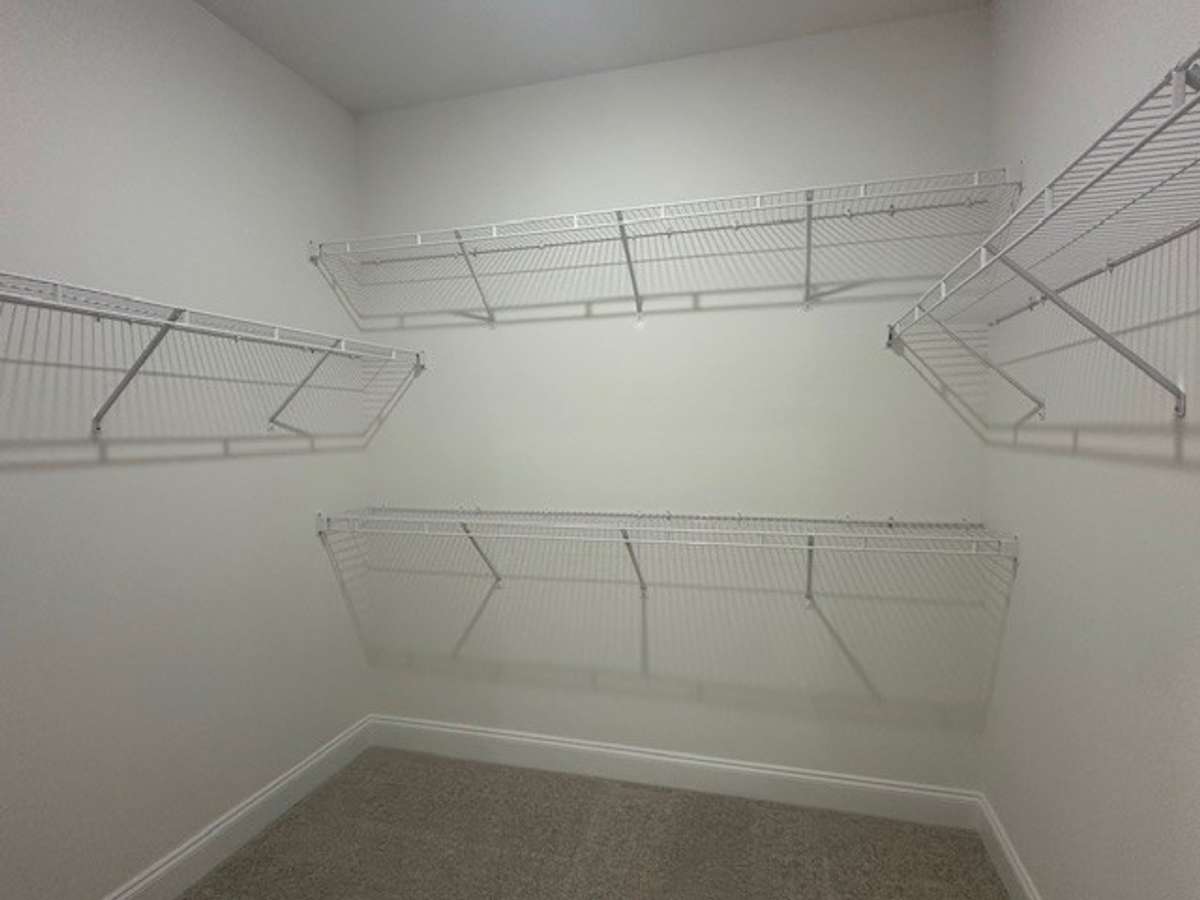 1 of 2 Walk In Closets for the Primary Bedroom! Plenty of space for all!