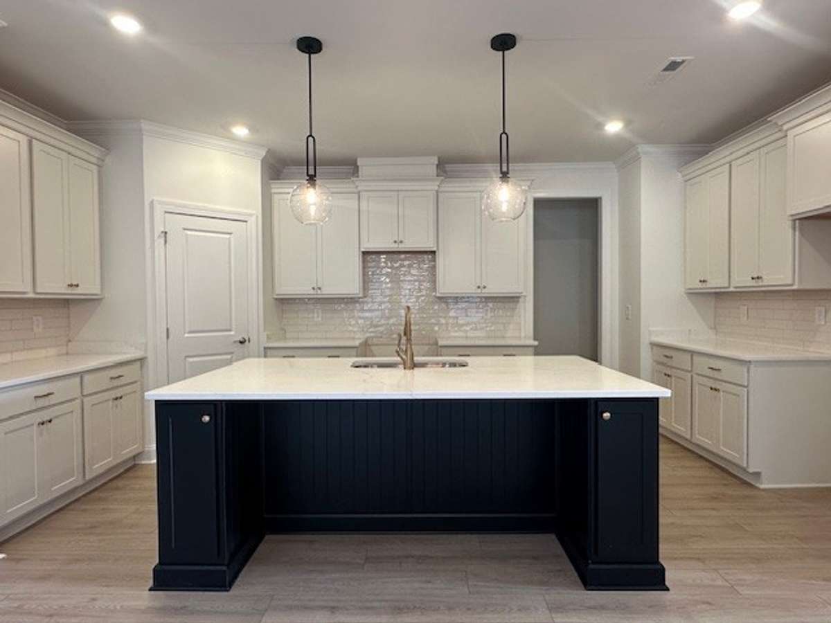 Cooking in this gourmet kitchen showcasing quartz countertops and an island over 7 feet long will be a dream!