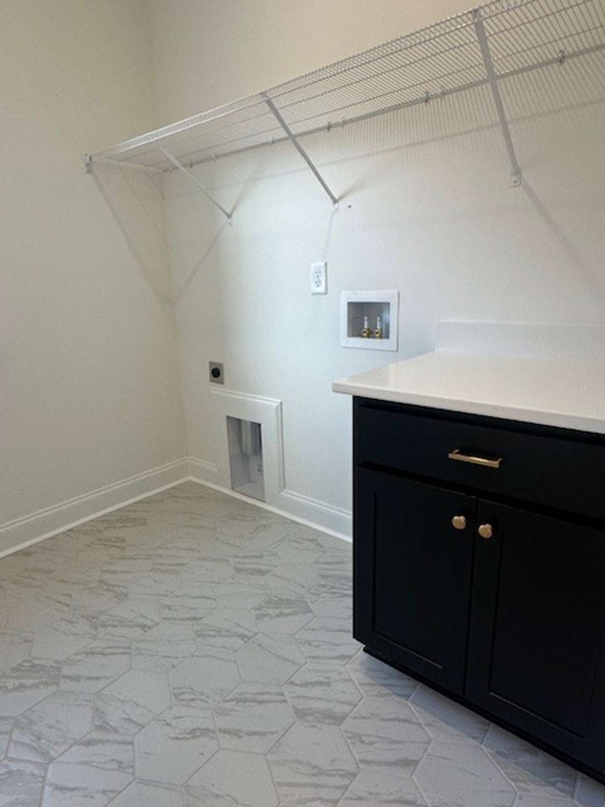 Look at this fun tile flooring in the laundry room! Absolutely gorgeous!