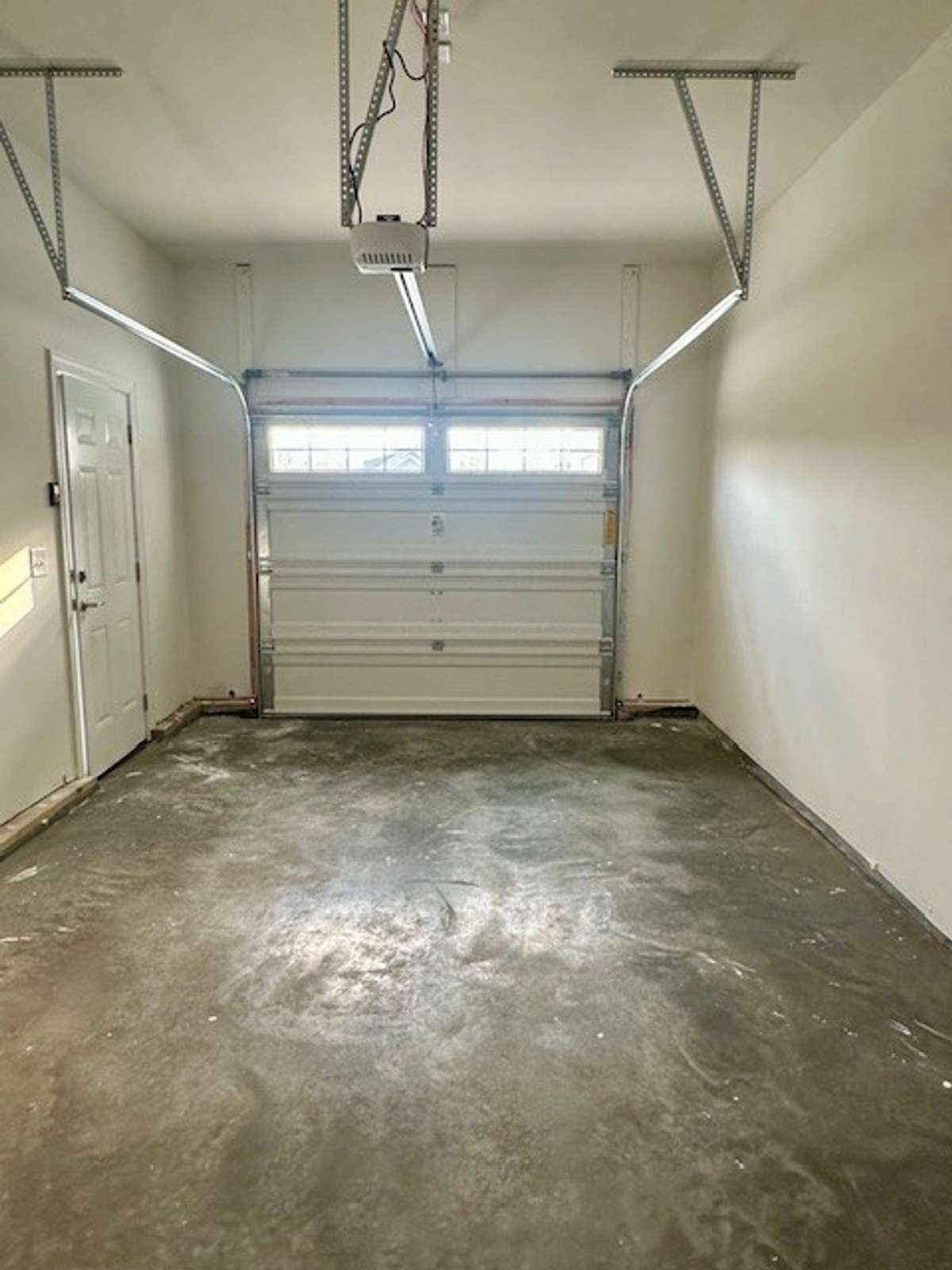Inside the 3rd car "carriage" garage bay, so convenient with both a garage door, as well as a side pedestrian door!