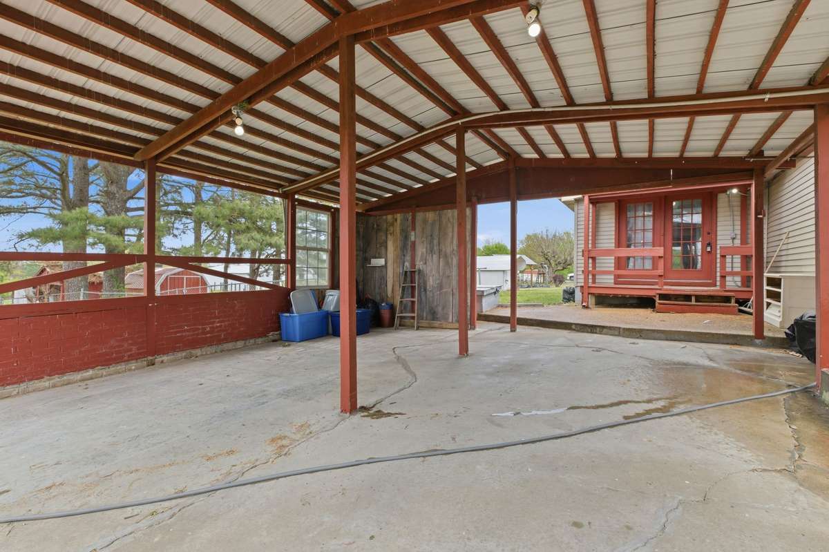 Carport by rear entrance.