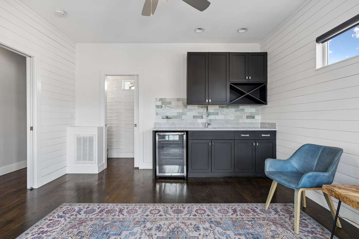 A second look at the third-floor flex space featuring a private powder room, offering added convenience!