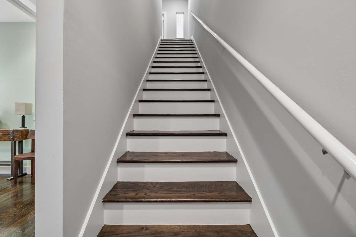 Heading up to the second floor featuring 9 ft ceilings throughout, including the primary suite, bonus room, and second and third bedrooms.