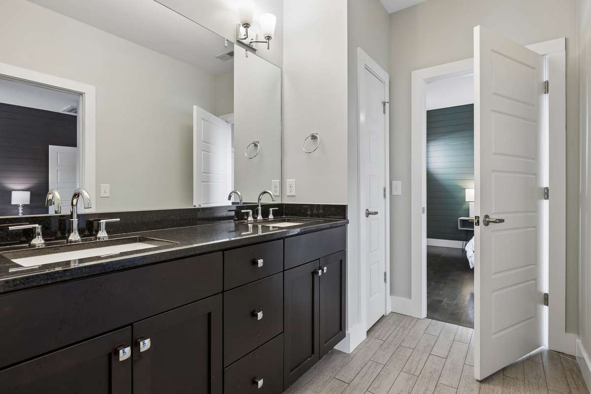Full bath featuring a double vanity and shared access from both 2nd and 3rd bedrooms.