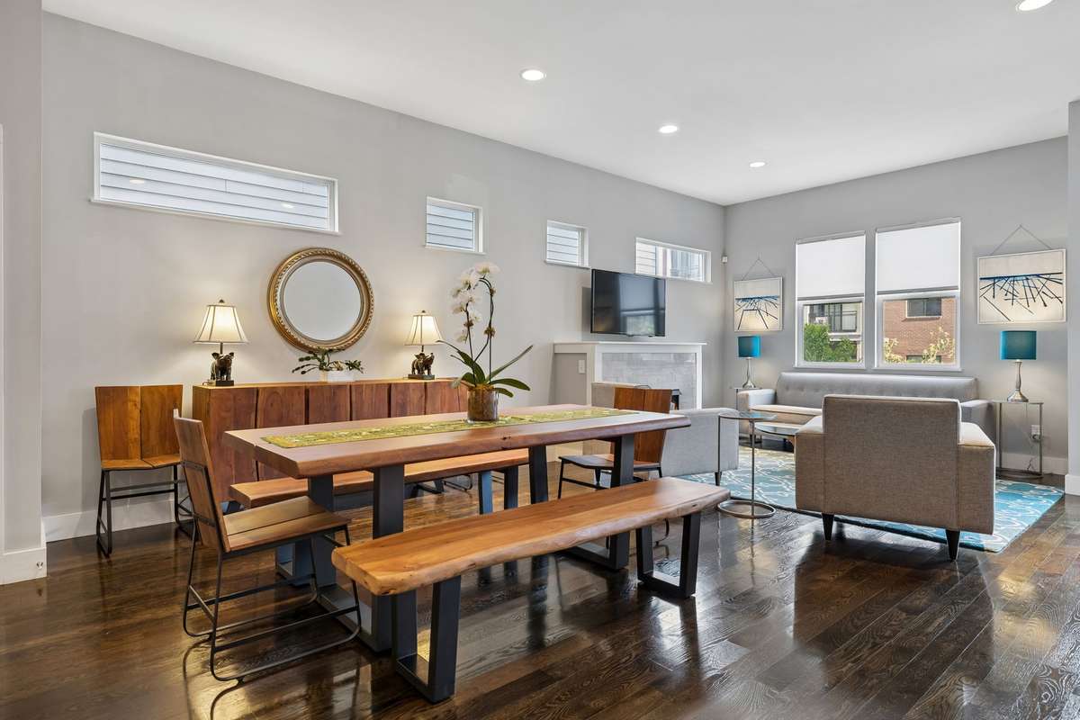 A view of the dining area that can accommodate a generously sized table along with additional furniture.