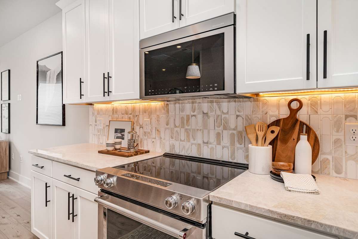 The kitchen features ample cabinetry, modern appliances, and generous counter space, making it ideal for everyday cooking or entertaining*Photos are of a similar floorplan with differing finishes.*