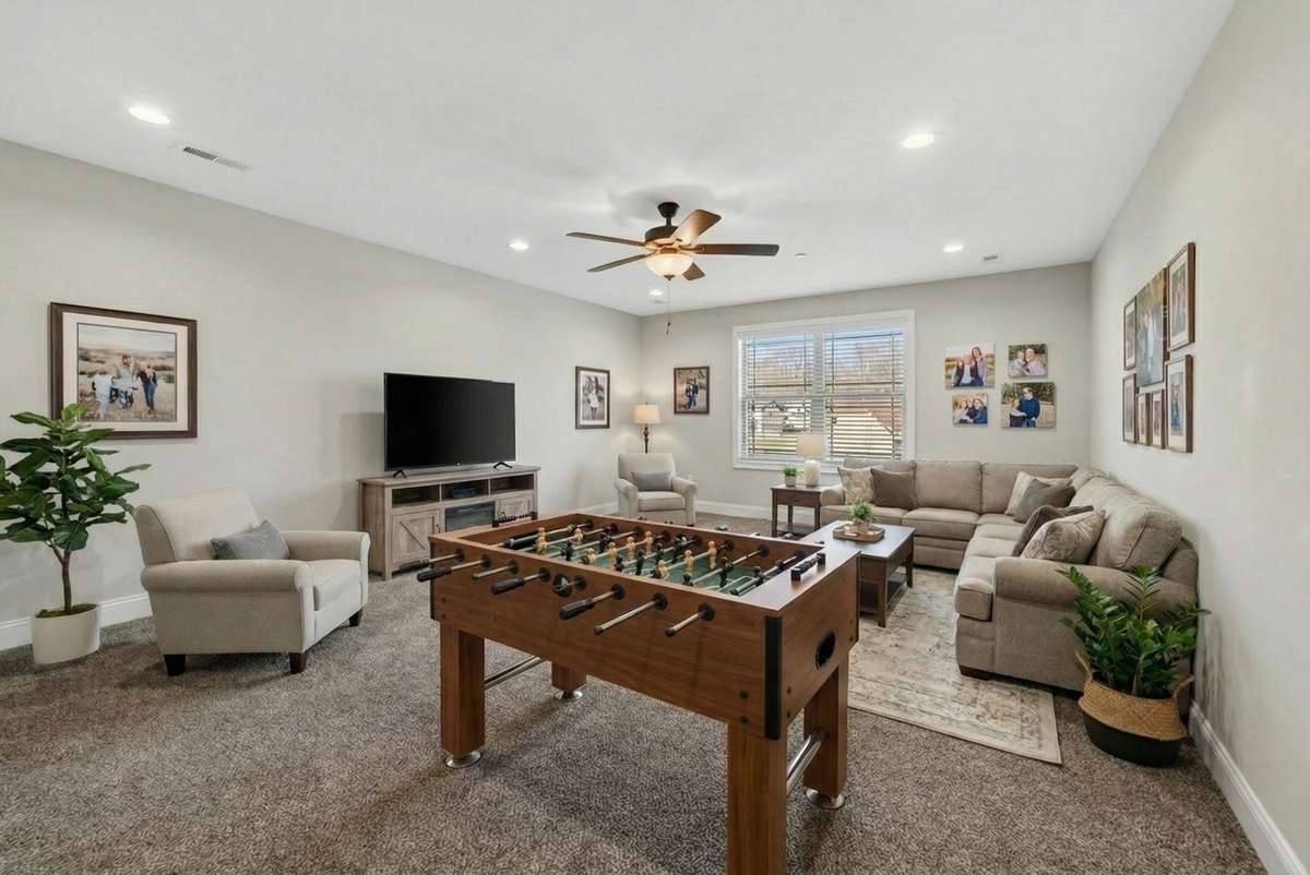 The upstairs bonus room has been virtually staged.