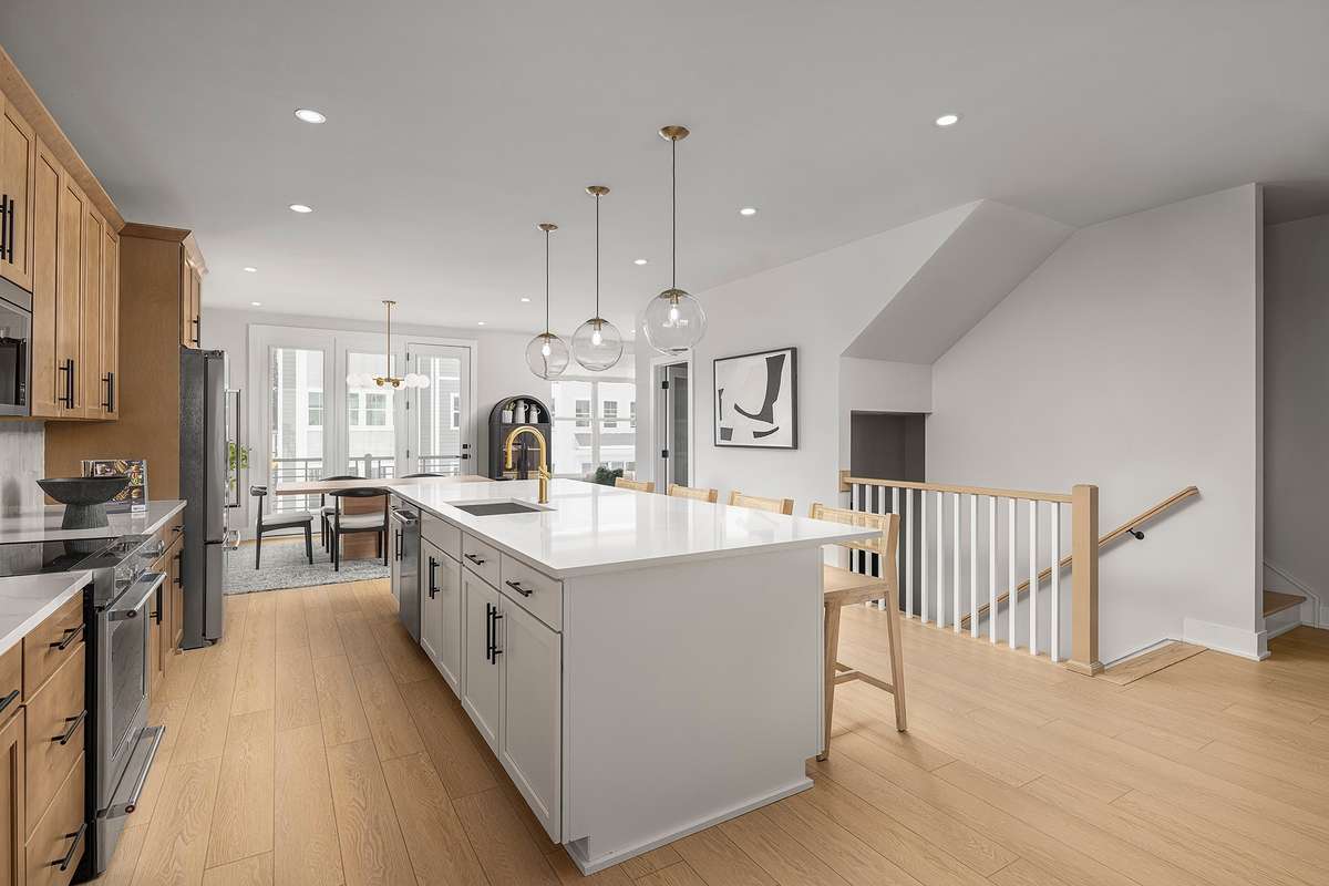 The kitchen features ample cabinetry, modern appliances, and generous counter space, making it ideal for everyday cooking or entertaining *Photos are of a similar floorplan with differing finishes*