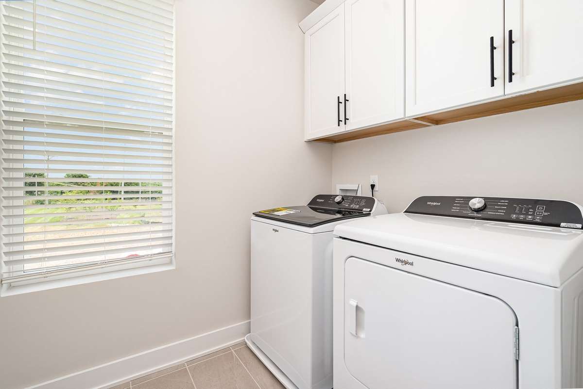 Whether used for quick loads or weekly laundry routines, this room delivers comfort and convenience, keeping everything you need within easy reach while maintaining a tidy, streamlined look.*Photos are of a similar floorplan with differing finishes.*