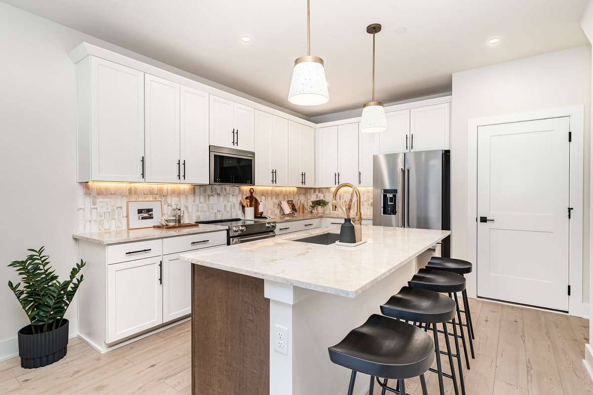 This inviting eat‑in kitchen blends functionality and comfort, creating a perfect gathering space at the heart of the home. *Photos are of a similar floorplan with differing finishes.*