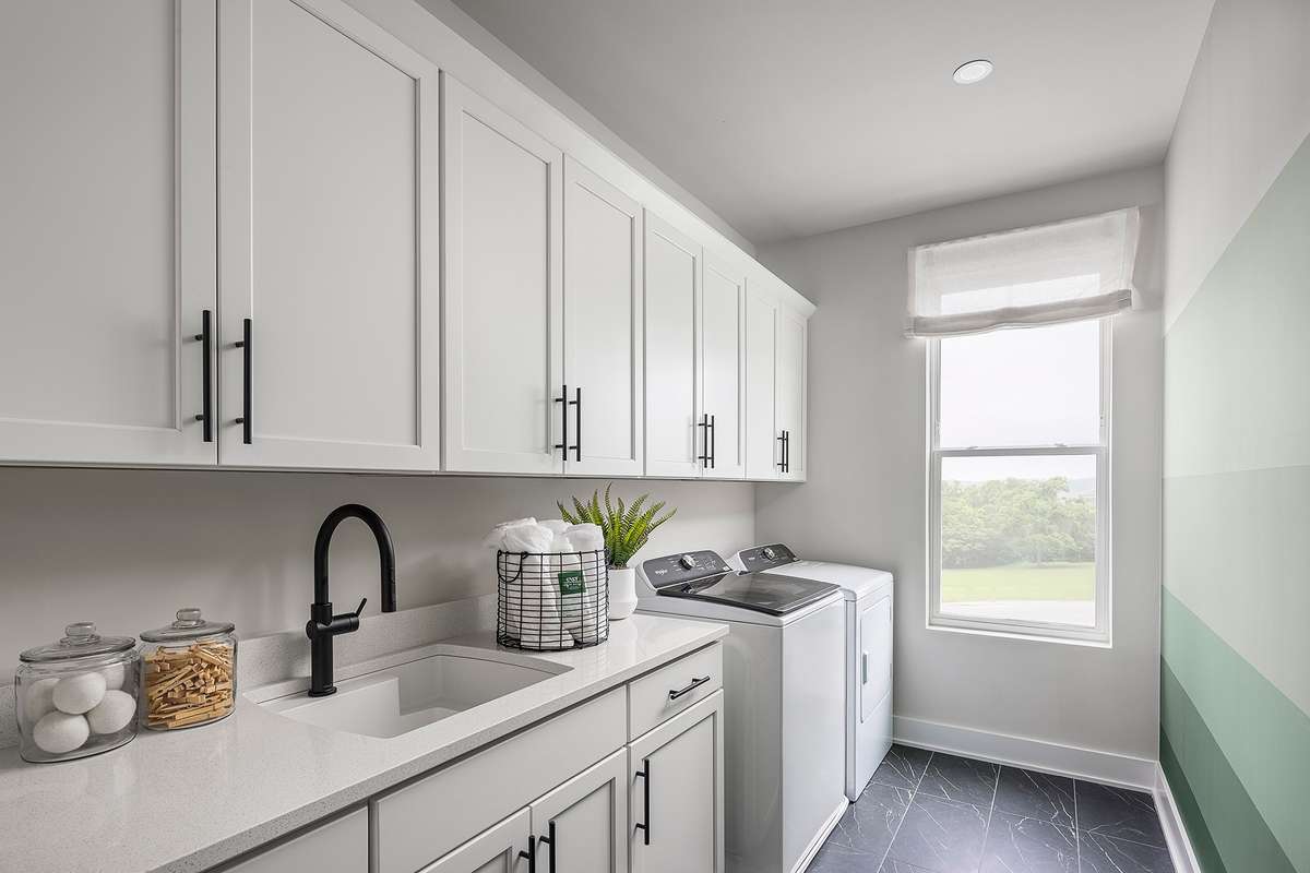 Whether used for quick loads or weekly laundry routines, this room delivers comfort and convenience, keeping everything you need within easy reach while maintaining a tidy, streamlined look.*Photos are of a similar floorplan with differing finishes*