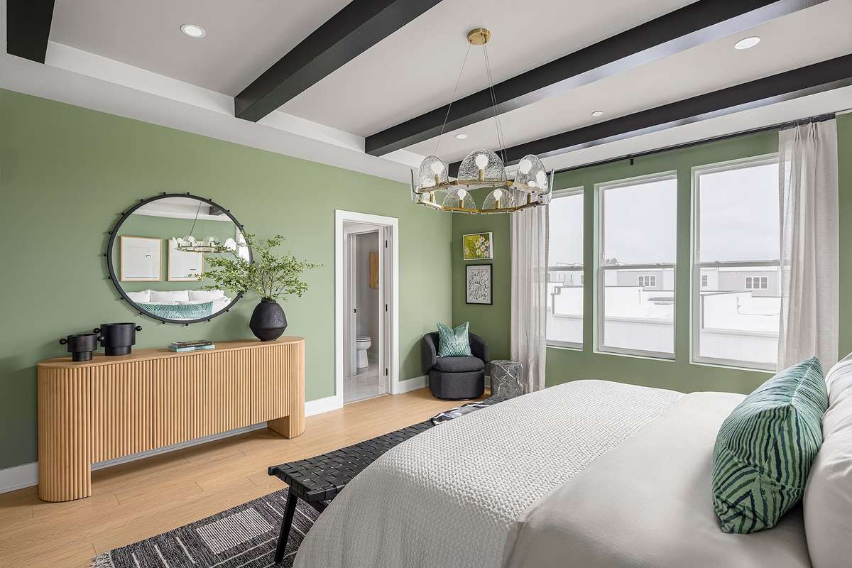 Generous layout easily accommodates a full furniture arrangement, while large windows invite soft natural light that enhances the room’s calm, welcoming atmosphere.*Photos are of a similar floorplan with differing finishes*