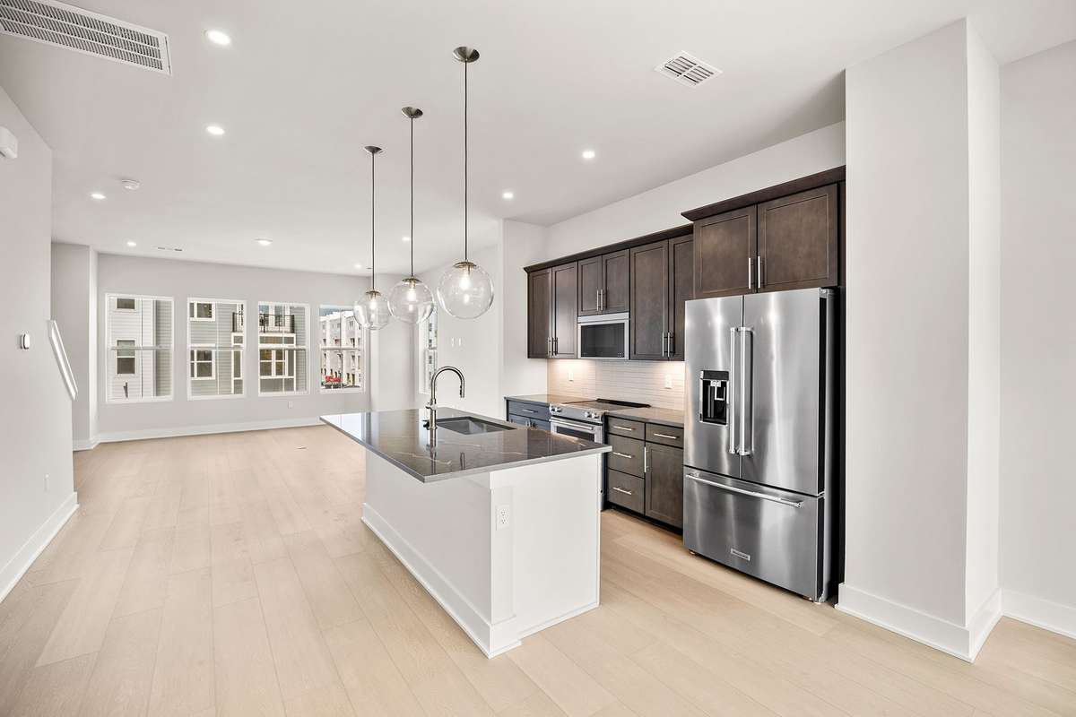 The kitchen includes upgraded Kitchenaid appliances.