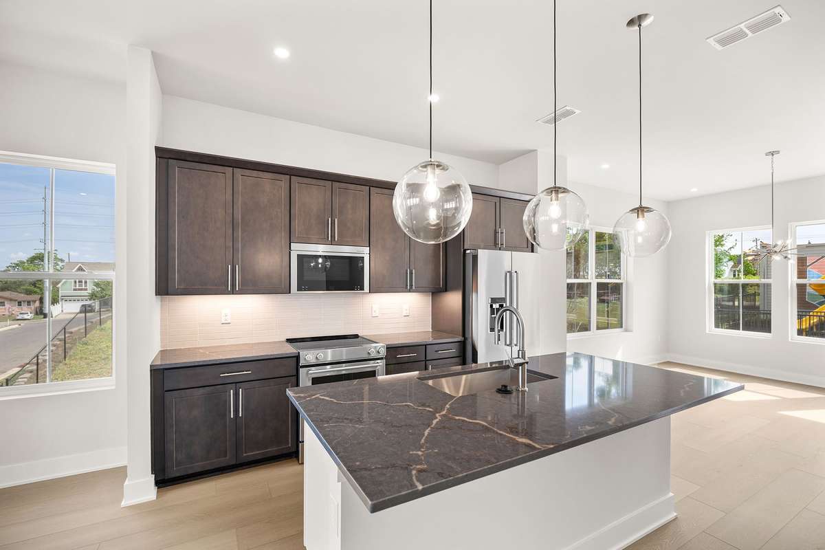 This thoughtfully designed end unit features open-concept kitchen, living & dining areas with TONS of natural light.