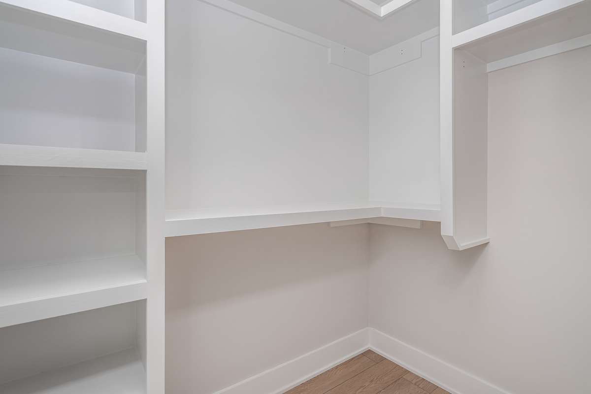 Primary walk -in closet (one of two)  *Photos are for representational purposes only and are of a similar floor plan with differing finishes*