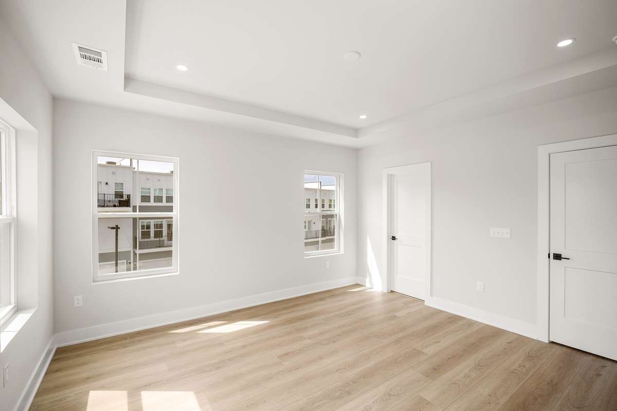 The secondary 3rd floor bedroom is also a suite featuring a walk-in closet & private ensuite bathroom.