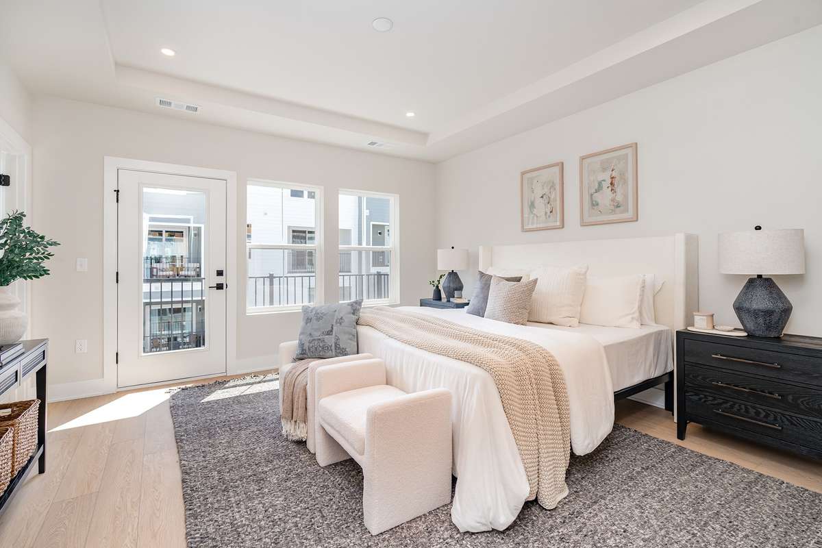 Primary bedroom with private deck  *Photos are for representational purposes only and are of a similar floor plan with differing finishes*