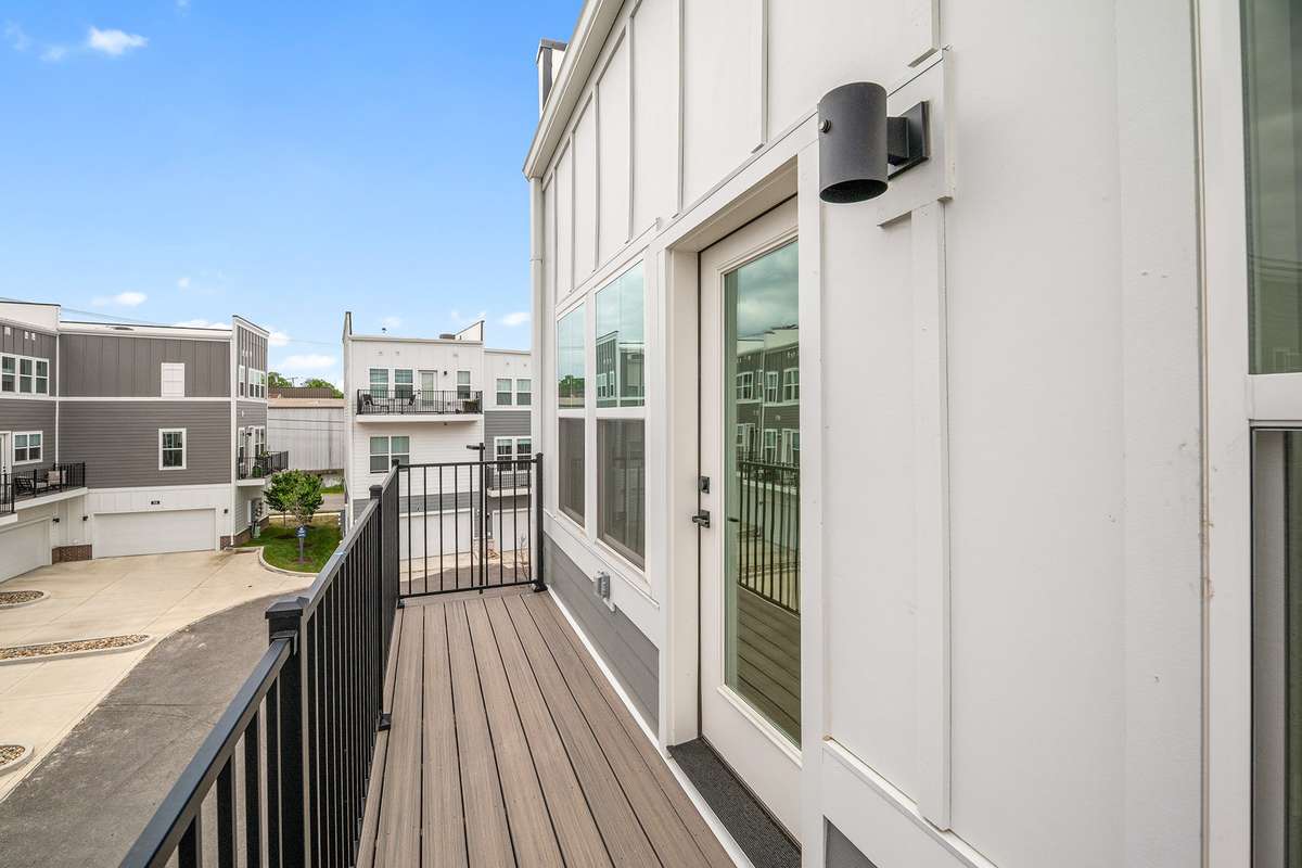 The private balcony is located just off the primary suite.