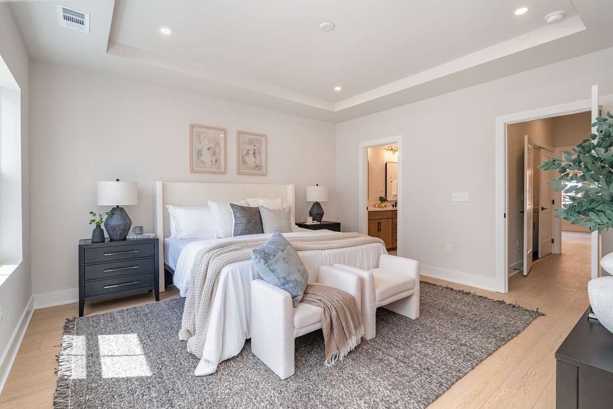 Primary bedroom with private deck  *Photos are for representational purposes only and are of a similar floor plan with differing finishes*
