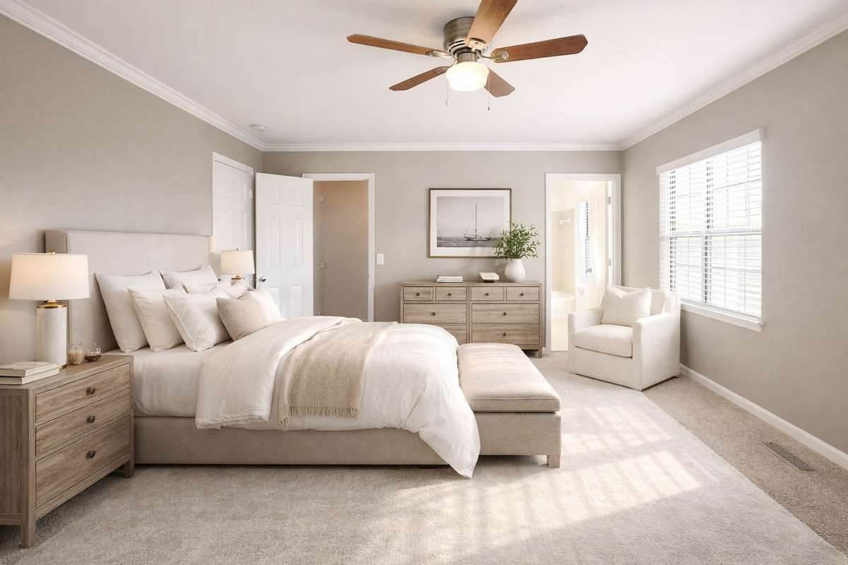 Sun-filled primary 14x11 bedroom with full bath, fresh paint, new carpet, ceiling fan, crown molding, and walk-in closet complemented by an illustrated visual use of the space. A perfect way to start and end each day!
